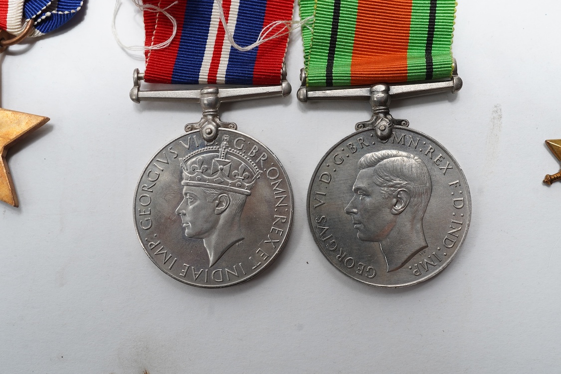 A First World War Mons Star trio awarded to Capt. A.D. Lowdell, with a clasp for 5th Aug-22nd Nov 1914, and oakleaf - mention in dispatches, together with the miniature set, plus a WWII Defence medal in its original card